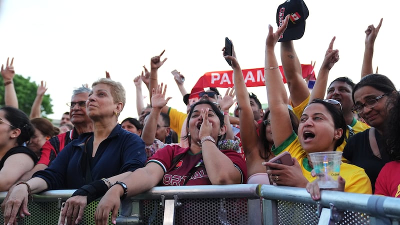 People cheer during a countdown concert ahead of the World Cup soccer tournament, Wednesday,...