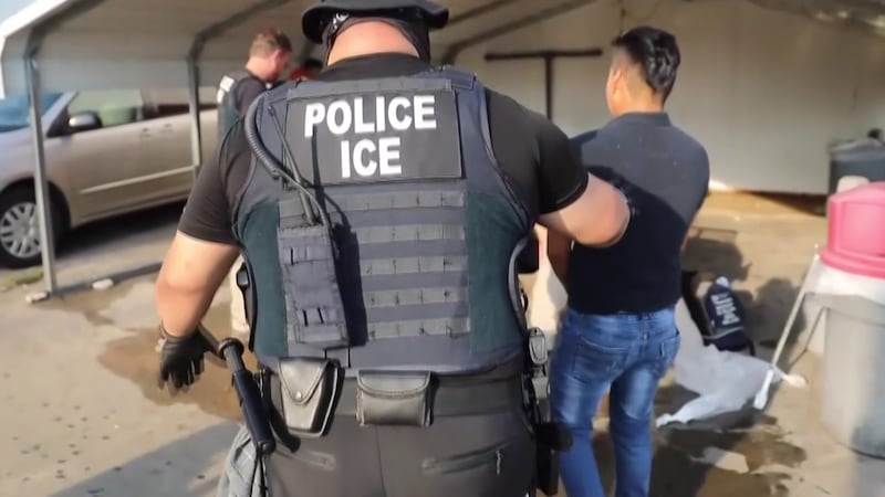 An ICE officer makes an arrest